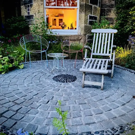 Scottish whinstone sett circle with polished black pebble detailing