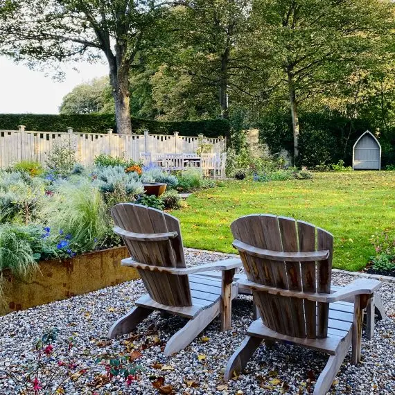 Adirondack chairs, garden design by Carolyn Grohmann