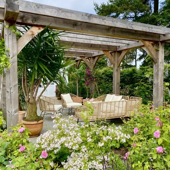 Scottish larch pergola with seating area