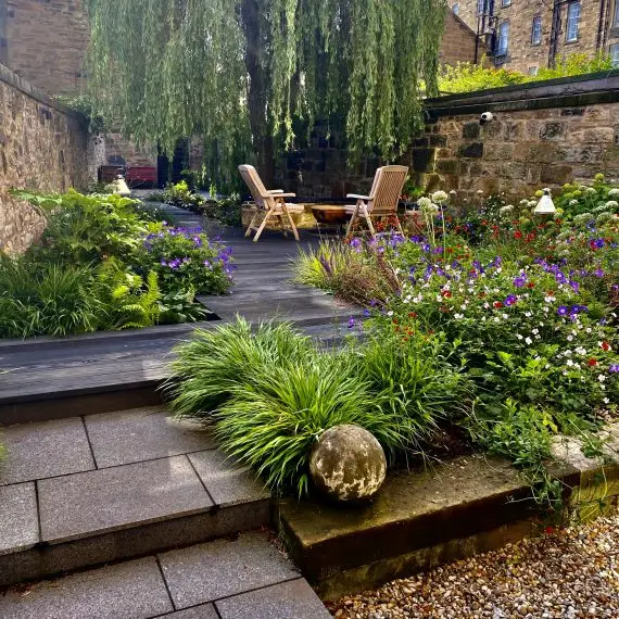 Black granite steps and Millboard decking