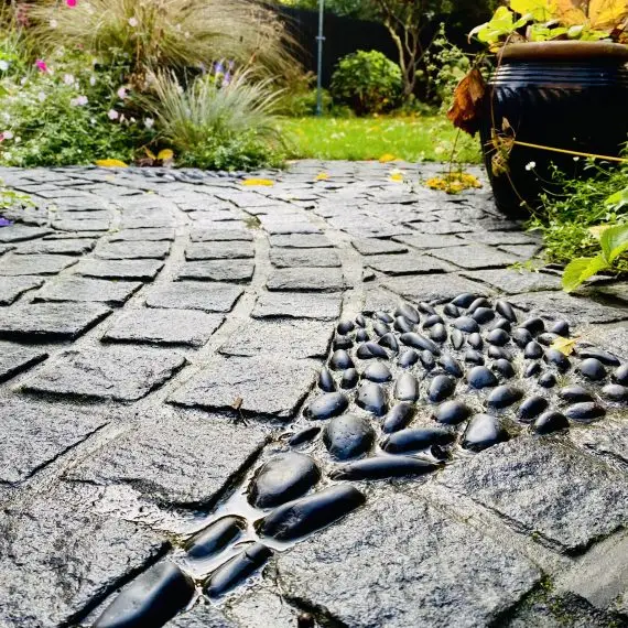 Scottish whinstone sett circle with polished black pebble detailing